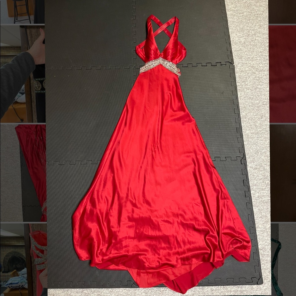 Red prom dress with low back, cut out sides, and detailed beading